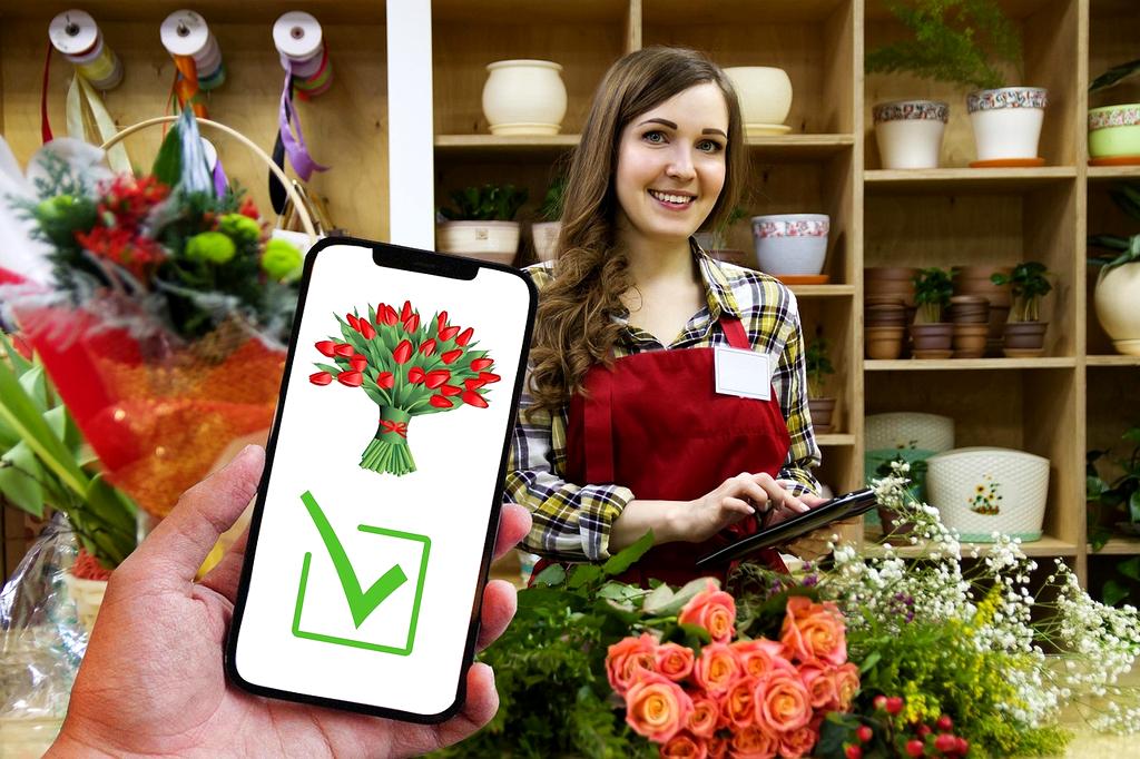 Bukiet ślubny z róż i piwonii na tle kościoła